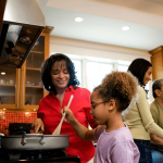 girl cooking with supervision